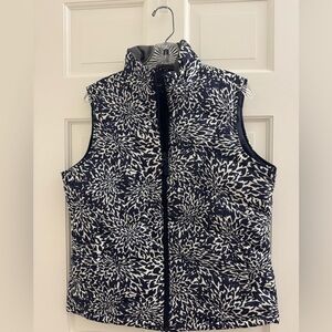 Light weight down vest. Navy and white. 
25” long and 21” chest width